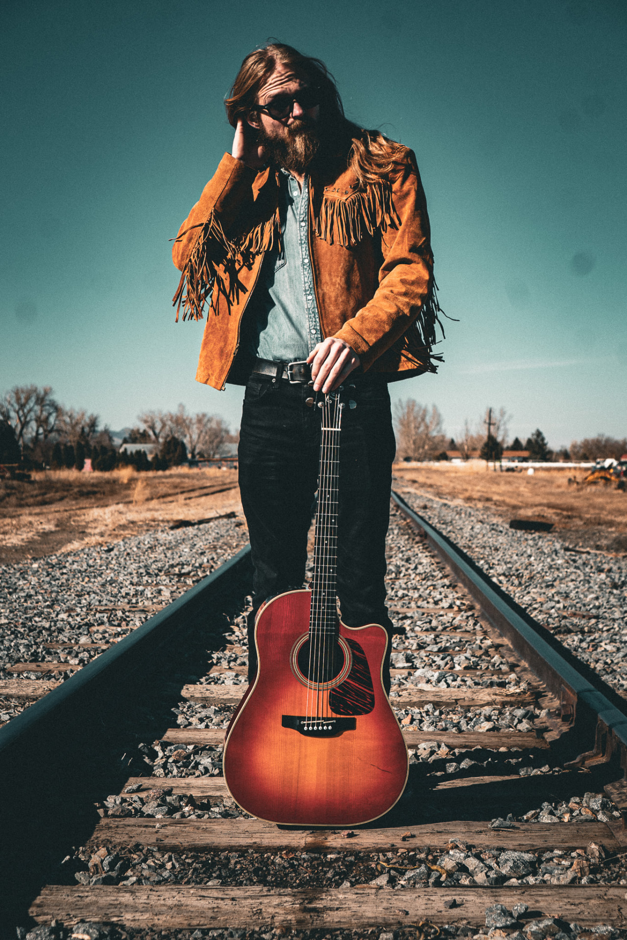 Railroad tracks, guitar upright